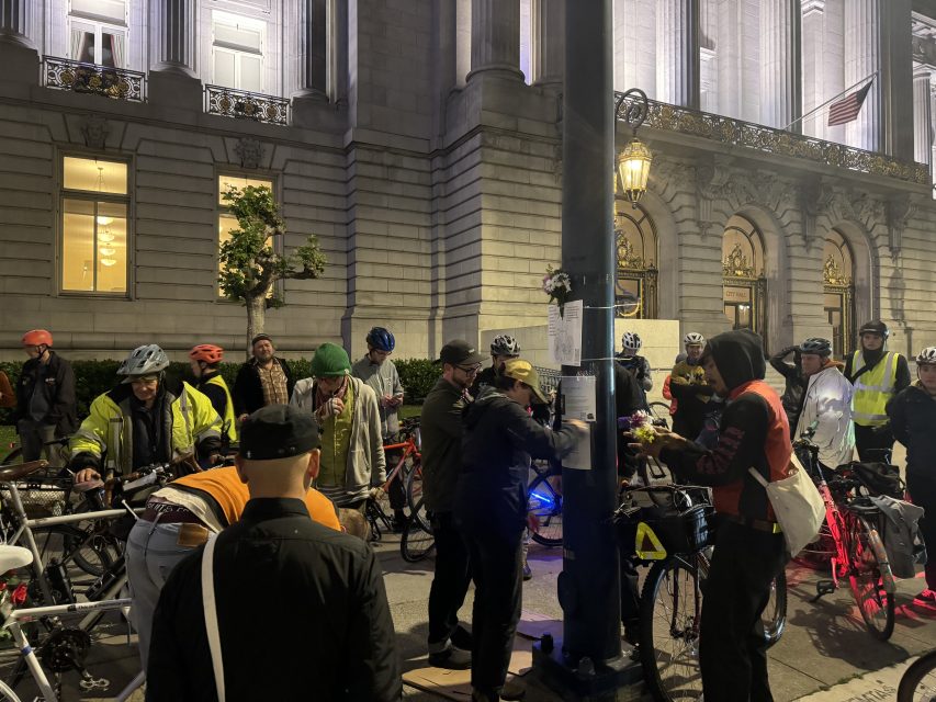 Attendees place the names of cyclists hit and killed around City Hall, for the last four years officials have lit up the building white to honor the ride on Wednesday May 15, 2024. Photo by Oscar Palma.