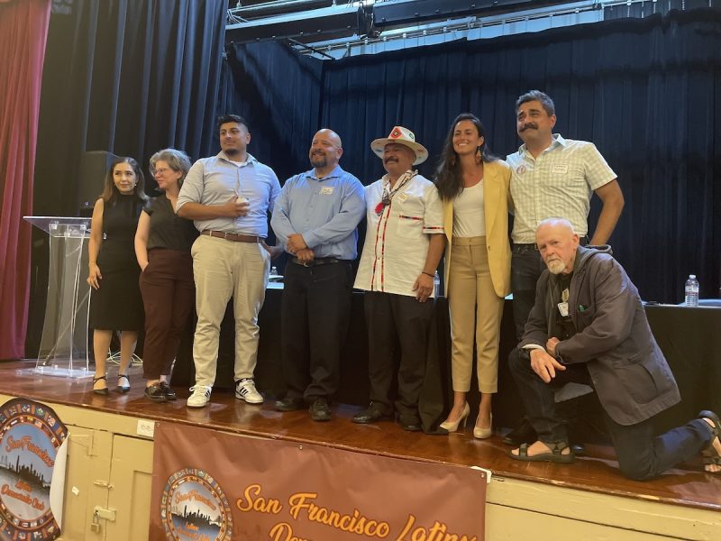District 9 candidates stand on a stage in front of a banner that reads "San Francisco Latino Democratic Club," following the Latinx Democratic Club Debate.