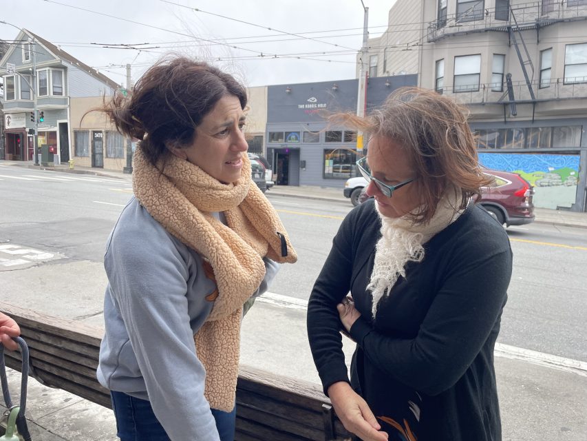 Supervisor Hillary Ronen speaks with Walk SF director Jodie Medeiros at a memorial on Mission and Cortland for San Francisco pedestrian fatalities on June 13. A man was killed here in a hit-and-run June 10. 