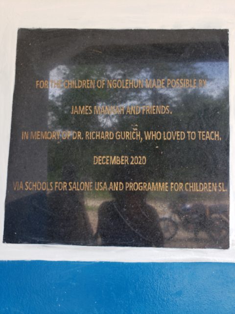 Plaque at the school in Ngolehun dedicated to friends and families that helped build the school. It also pays tribute to Dr, Richard Gurich, one of the biggest and dedicated donors in the organization. Photo courtesy of James Mannah.