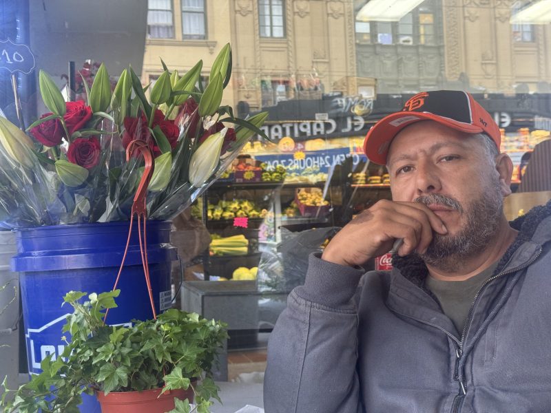 Jose Barajas poses for a photo next to his flower stand on Friday 26, 2024. Photo by Oscar Palma.