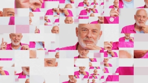A fragmented collage of an older man with a beard wearing a bright pink shirt, shown in numerous small, overlapping rectangular sections.