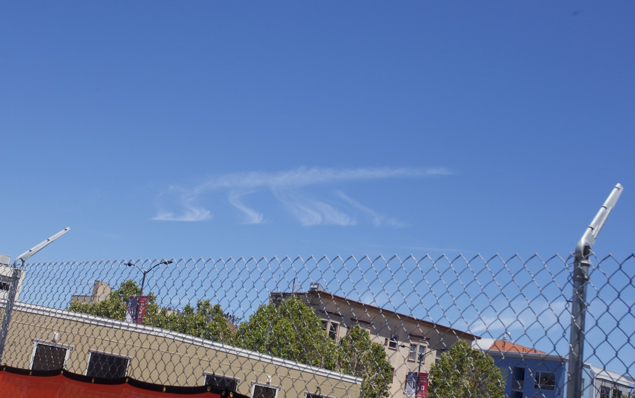 A clear blue sky with wispy clouds.