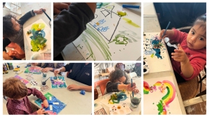 Five young children are shown painting pictures at a table. They use various colors and paintbrushes, each focused on creating their own artworks.