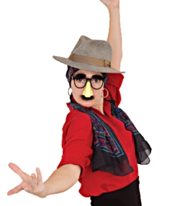 Person wearing a costume with glasses, a fake nose, a hat, and a scarf, striking a fun and dramatic pose.