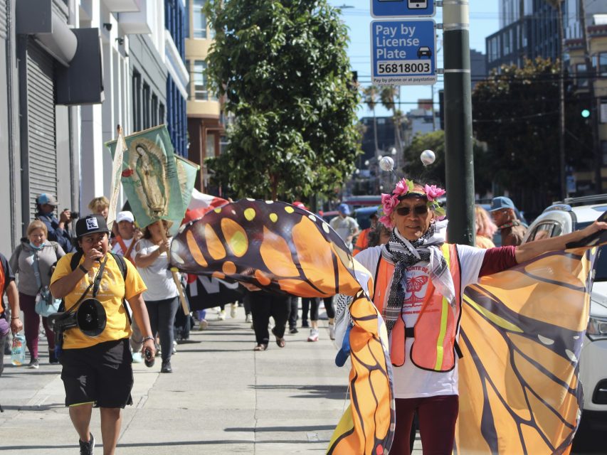 Volunteers march through Mission Street on their way to City Hall.