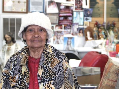Maria Bollozos poses for a photo inside of Abner's Barbershop, the business she started in 1986, on Thursday Aug. 22, 2024. Photo by Oscar Palma.