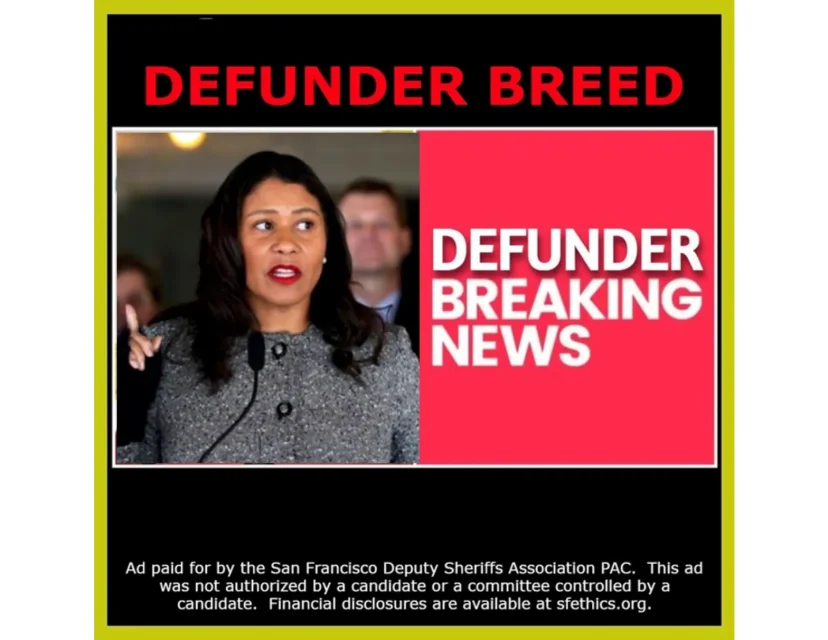 Person speaking in front of microphones with red text on the right side stating "DEFUNDER BREAKING NEWS." Text at the bottom mentions an ad paid for by the San Francisco Deputy Sheriffs' Association PAC.
