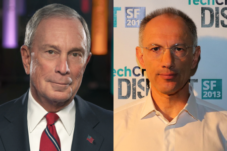 Two men are pictured: the one on the left wearing a suit and red tie, and the one on the right in a white shirt standing in front of a backdrop with logos.