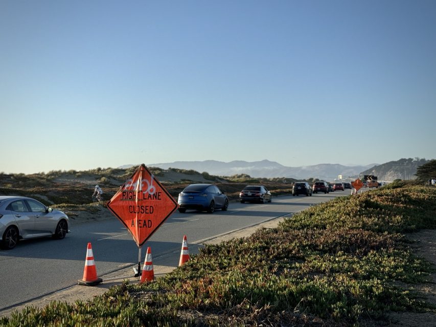Traffic cones and a sign indicating 