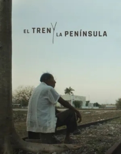 A person sitting beside a railway track with "El Tren y La Península" text above. A tree trunk is visible on the left, and there's an open landscape in the background.