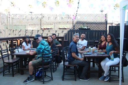 The lunch poses for a photo while enjoying their tacos at Frisco Flavor. Photo by Emmanuel Fonseca.