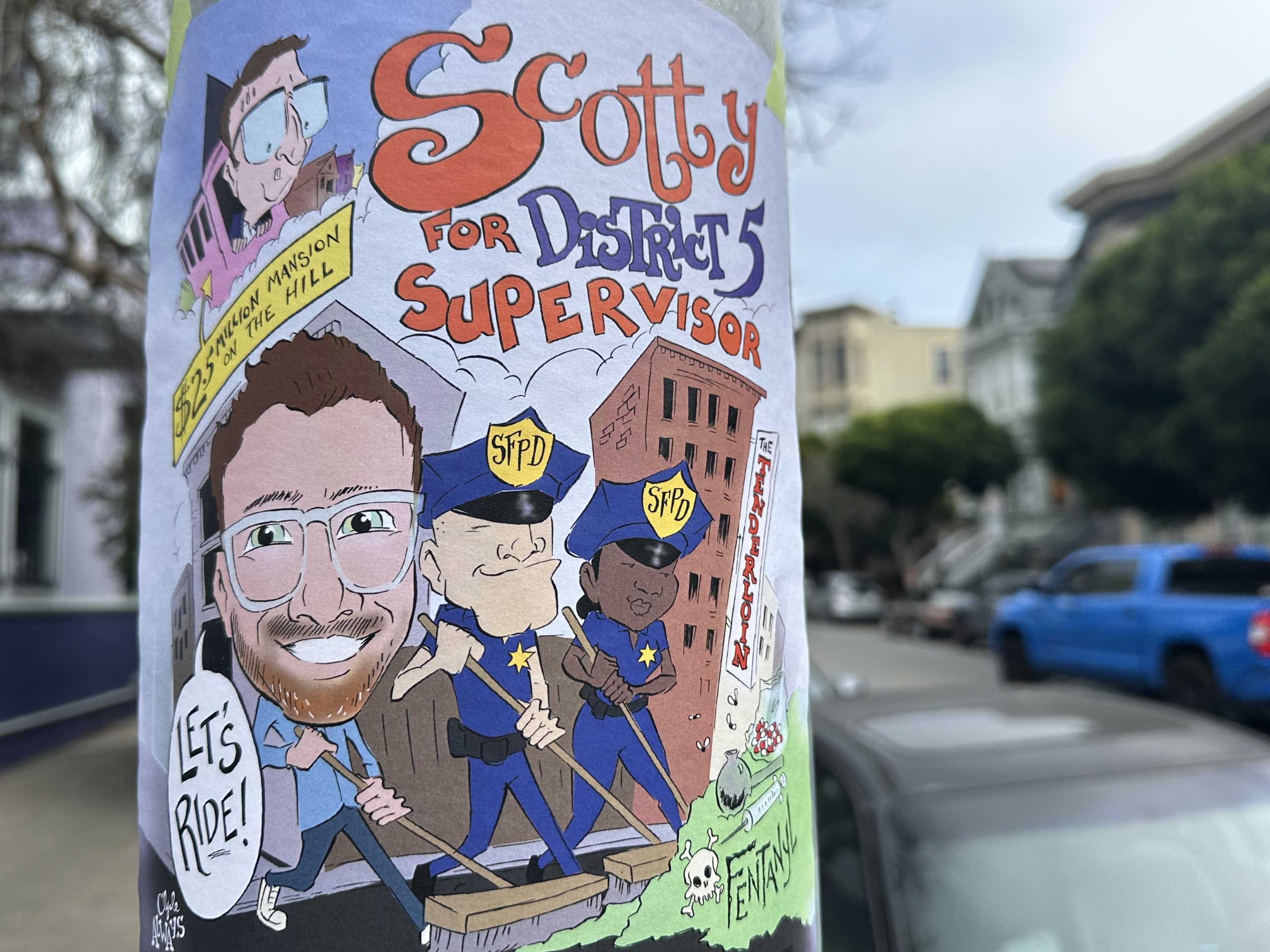 A colorful street poster features a cartoon character named Scotty Jacobs campaigning for District 5 Supervisor, surrounded by cartoon police officers and city buildings, with the phrase "Let's Ride!