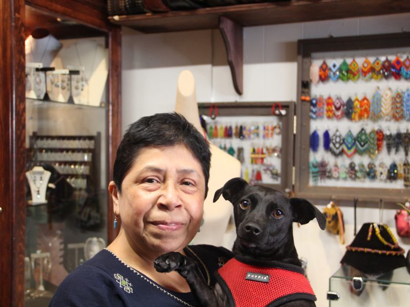 Diana Medina poses for a photo with her dog Yuma inside of her store on Thursday Nov. 7, 2024. Photo by Oscar Palma.