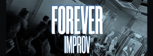 A dimly lit room with people seated and standing. Large text overlay reads "FOREVER IMPROV." Stage lights highlight part of the audience and performers.