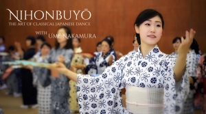 A person in a patterned kimono performs a classical Japanese dance in a group setting. Text: "Nihonbuyō, the art of classical Japanese dance with Umenakamura.