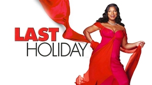 Woman in a flowing red dress stands confidently next to the title "Last Holiday" on a white background.
