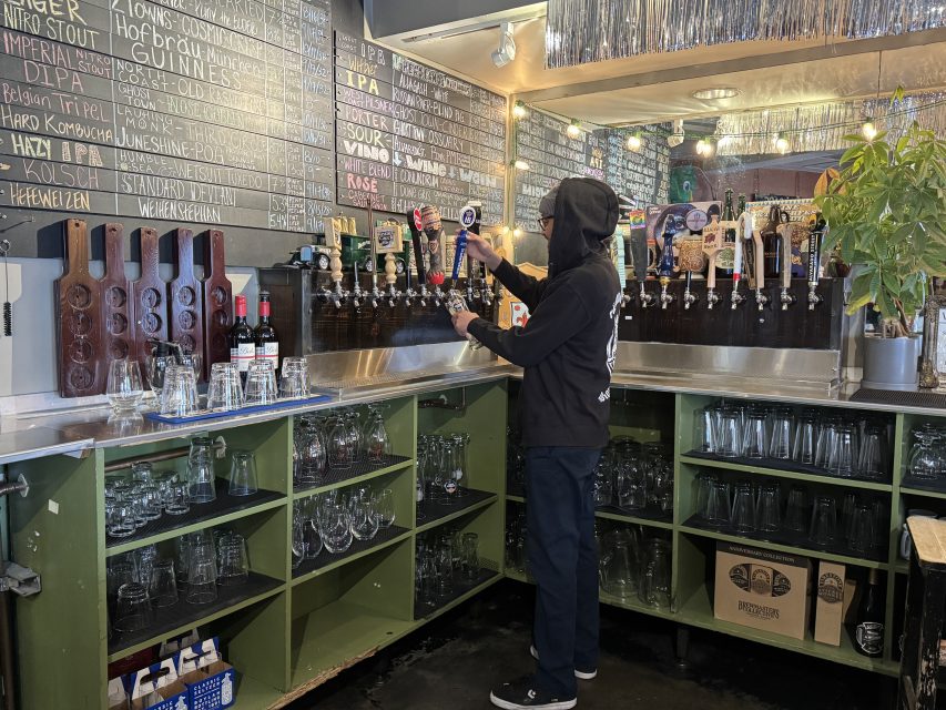 Danny Mendez, co-owner of Rosamunde, pouring his favorite beer, a Hafbrau lager, on Thursday Jan. 30, 2025. Photo by Oscar Palma.