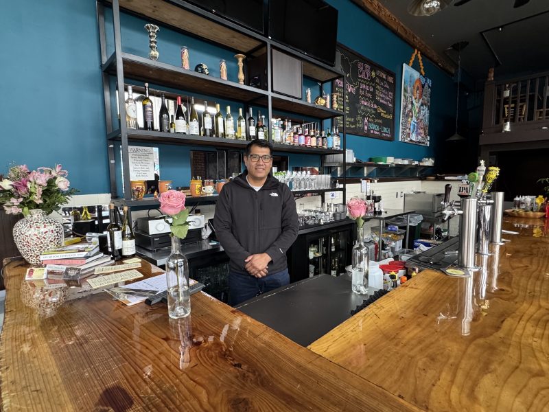 Hector Cortes poses behind the bar at Murales at 18th and Mission streets on Wednesday Jan. 29, 2024. Photo by Oscar Palma.