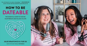 Two women with microphones smiling. Beside them is a book titled "How to Be Dateable: The Essential Guide to Finding Your Person and Falling in Love.