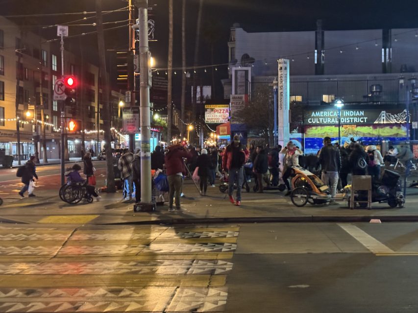 The sidewalk next to the Southwestern 16th Street BART station remains busy with vendors late at night on Monday March 10, 2025. Photo by Oscar Palma.