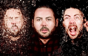 A bearded man is shown in three different expressions: eyes closed, neutral, and shouting, with a textured overlay effect.