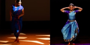 Two dancers in traditional attire perform on stage. The left dancer moves dynamically, while the right dancer poses gracefully with hands framing the face.