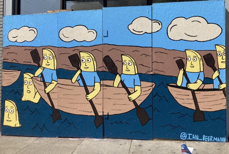 Colorful mural depicting cartoon characters in blue shirts rowing boats on a river with clouds above.