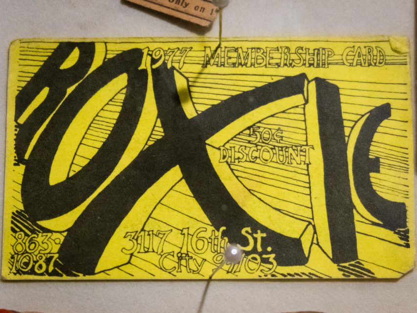 Yellow 1977 membership card for "ROXY," offering a 50¢ discount and listing the address "3117 16th St." with phone numbers 863-1087 and CRY-1093.