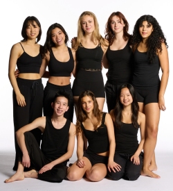 Eight young adults pose together in black athletic wear against a white background.