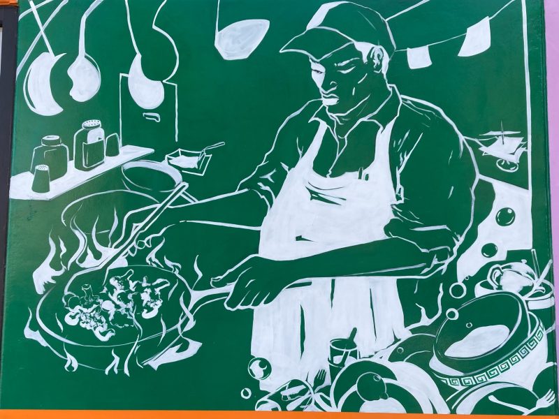 Illustration of a cook wearing an apron and cap, preparing food in a pan over a stove, surrounded by kitchen utensils and cookware.