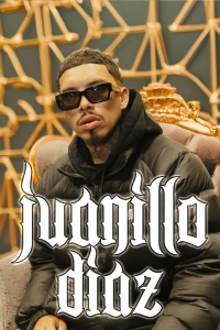 A man in dark sunglasses and a black jacket sits on an ornate chair with gold details; stylized text reads "juanillo diaz.