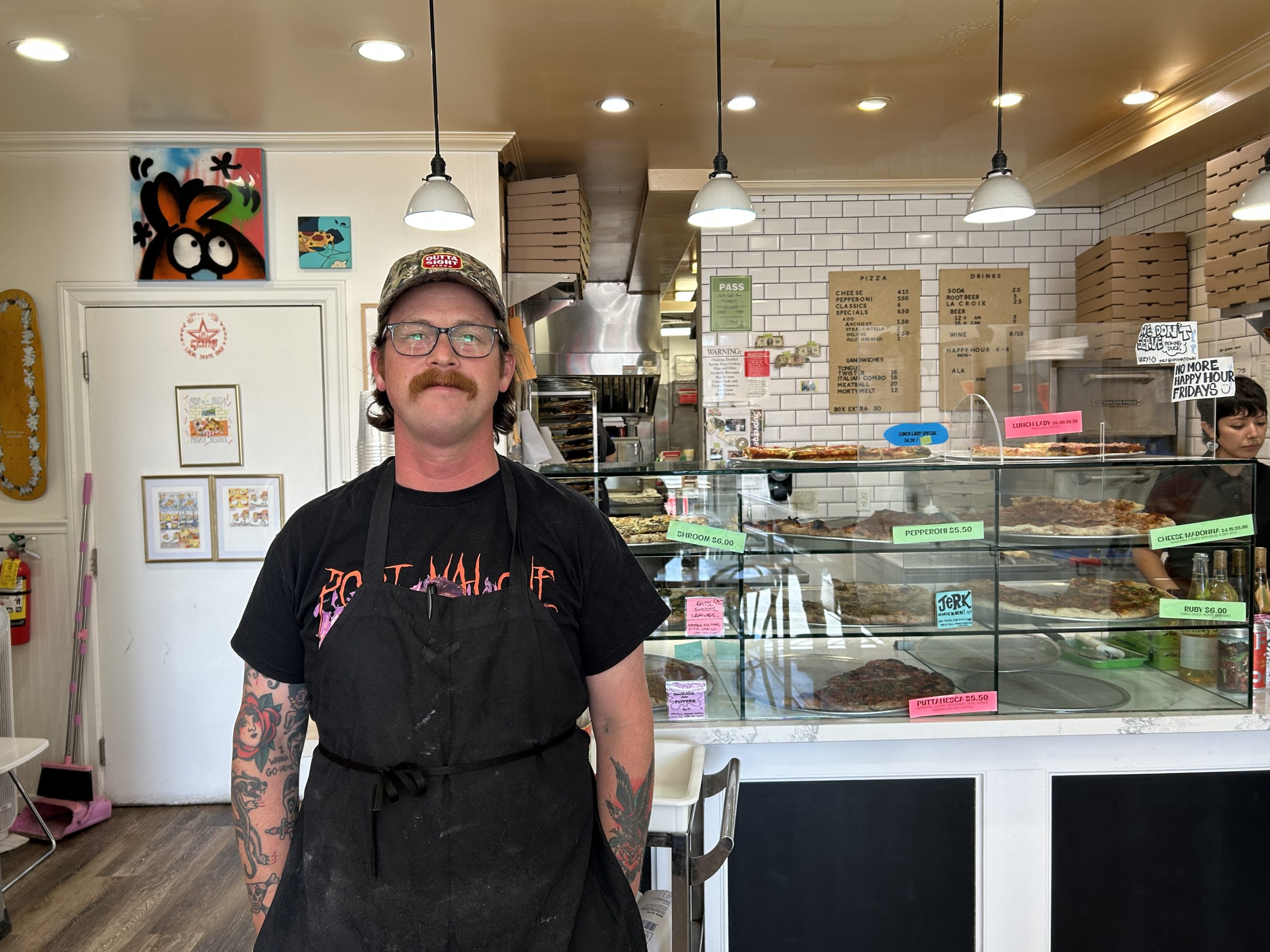Customers line up for S.F. Tenderloin's Outta Sight Pizza