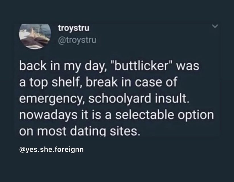 Screenshot of a tweet joking that "buttlicker" was once an insult but is now a selectable option on dating sites.