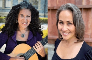 Two women are shown side by side; the woman on the left holds a guitar and smiles, while the woman on the right also smiles. Both have gray-streaked hair and wear black tops.