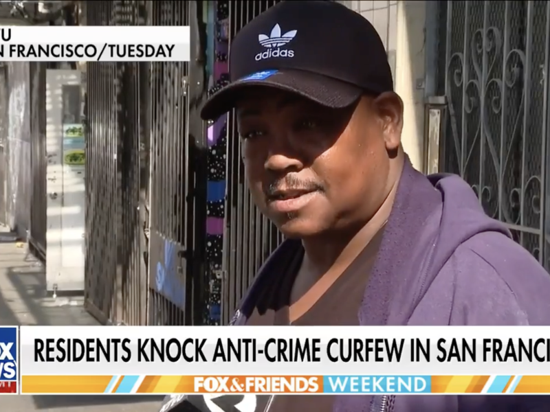 A man in a black Adidas cap speaks outdoors in San Francisco, shown in a Fox News segment discussing an anti-crime curfew.