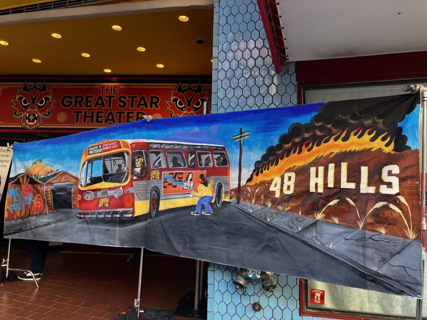 A painted mural shows a bus labeled "48," a person skating, burning hills, and the words "48 Hills" in front of The Great Star Theater entrance.