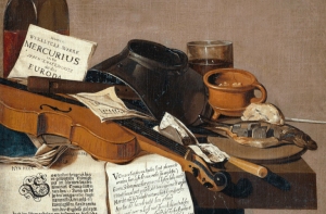 A still life with a violin, sheet music, books, papers, an inkwell, a cup, and a glass arranged on a wooden surface.