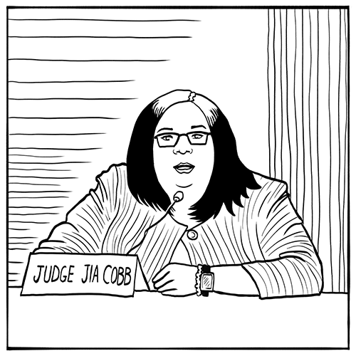A judge with long hair and glasses sits behind a microphone and a nameplate that reads "Judge Jia Cobb.