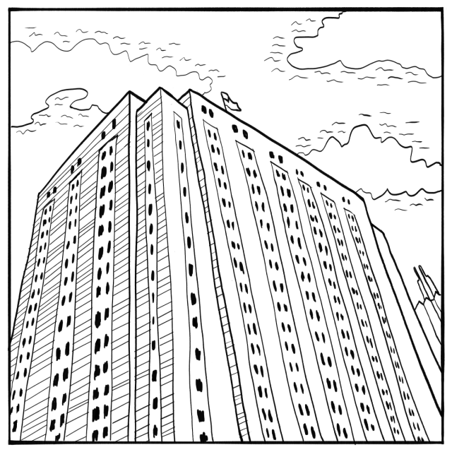 A tall, rectangular high-rise building with many windows, viewed from a low angle, with a flag on top and partly cloudy sky in the background.
