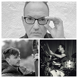 A black-and-white collage shows a man adjusting his glasses, a second man playing upright bass, and a third playing drums on stage.