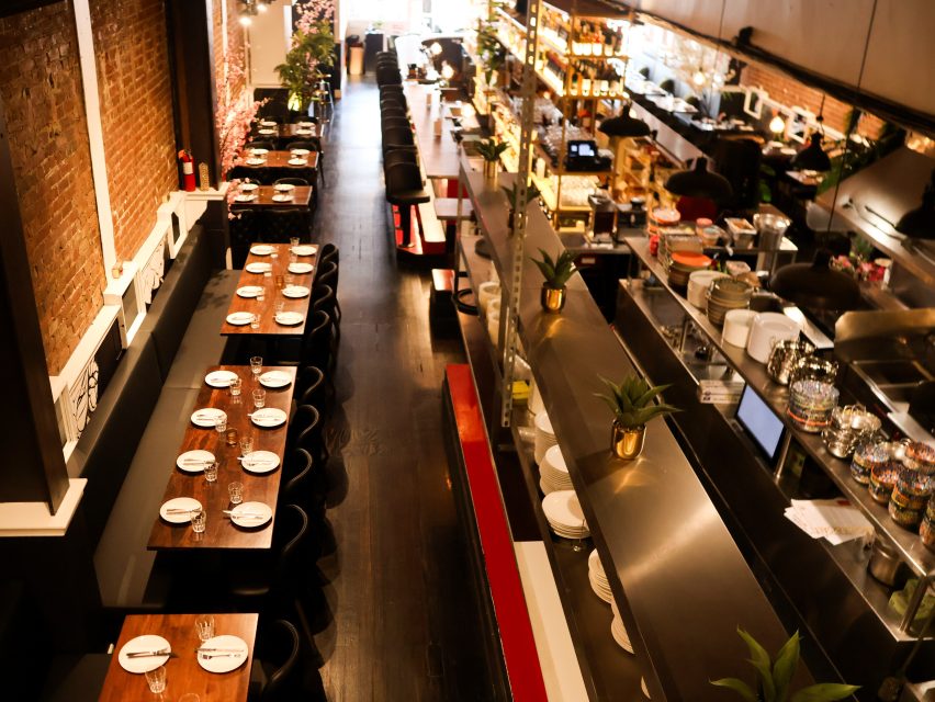 A restaurant with tables and chairs.