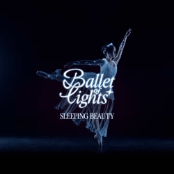 A ballerina in a white costume dances on stage with "Ballet of Lights: Sleeping Beauty" written in white text over the image.