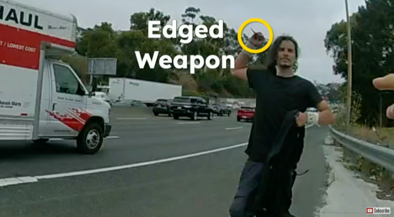 A man holds an edged weapon above his head while running on a highway near a U-Haul truck; the words "Edged Weapon" are on the image.