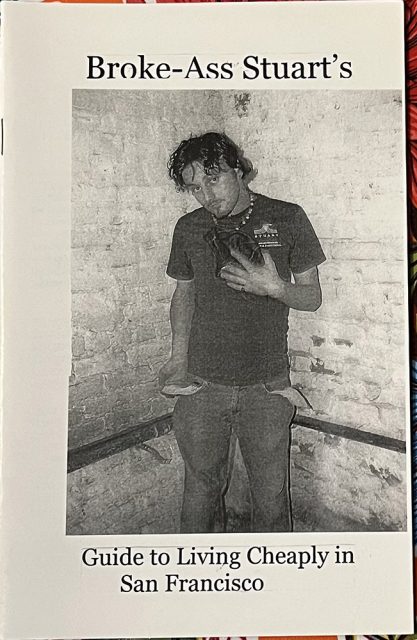 A person stands in a corner holding a pigeon. The cover text reads, "Broke-Ass Stuart's Guide to Living Cheaply in San Francisco.