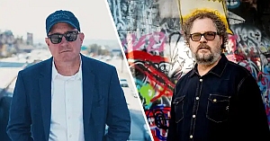 Two men stand in separate outdoor urban settings; the left man wears sunglasses, a blue cap, and a blazer, while the right man has curly hair, glasses, and a black shirt with graffiti in the background.