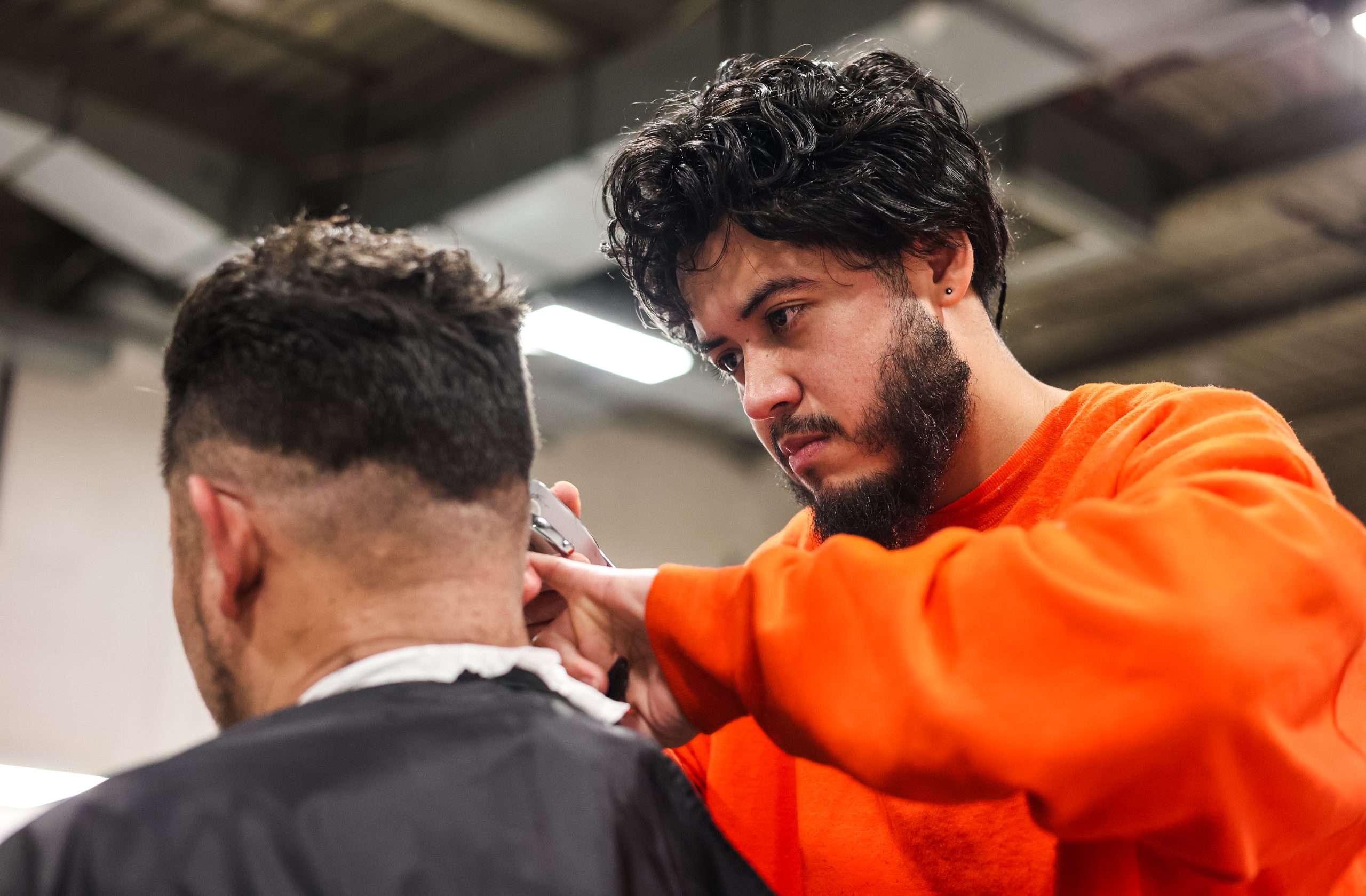 Inside S.F. jail, 13 freshly minted barbers graduate, each with a different hairstyle