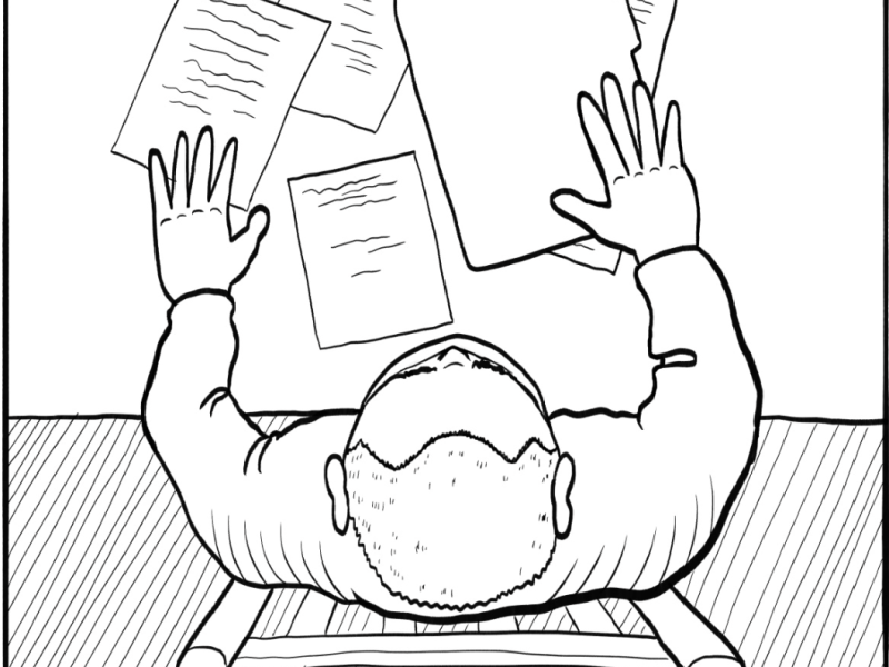 A person viewed from above sits at a desk with scattered papers, holding one sheet above the rest, closely examining it for signs of a scam.