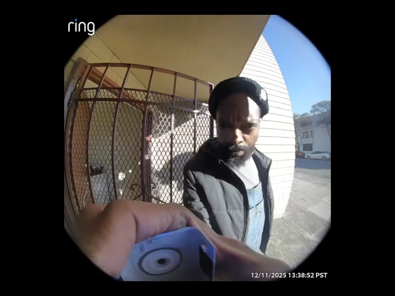 A man in a black beanie and jacket stands at a door, looking at a Ring doorbell camera. The date and time read 12/11/2025 13:38:52 PST.