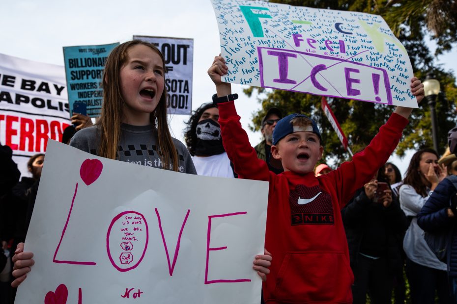 A group of people holding signs.